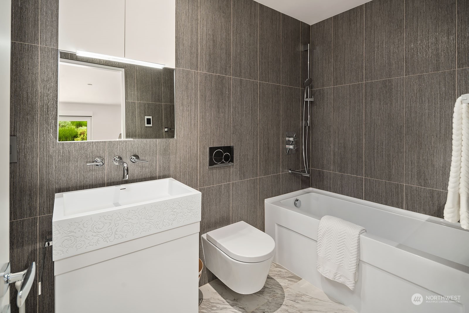 3225 Evergreen Point Road Medina, WA 98039 - Photo 16 of 34 a bathroom with a toilet a sink and bathtub