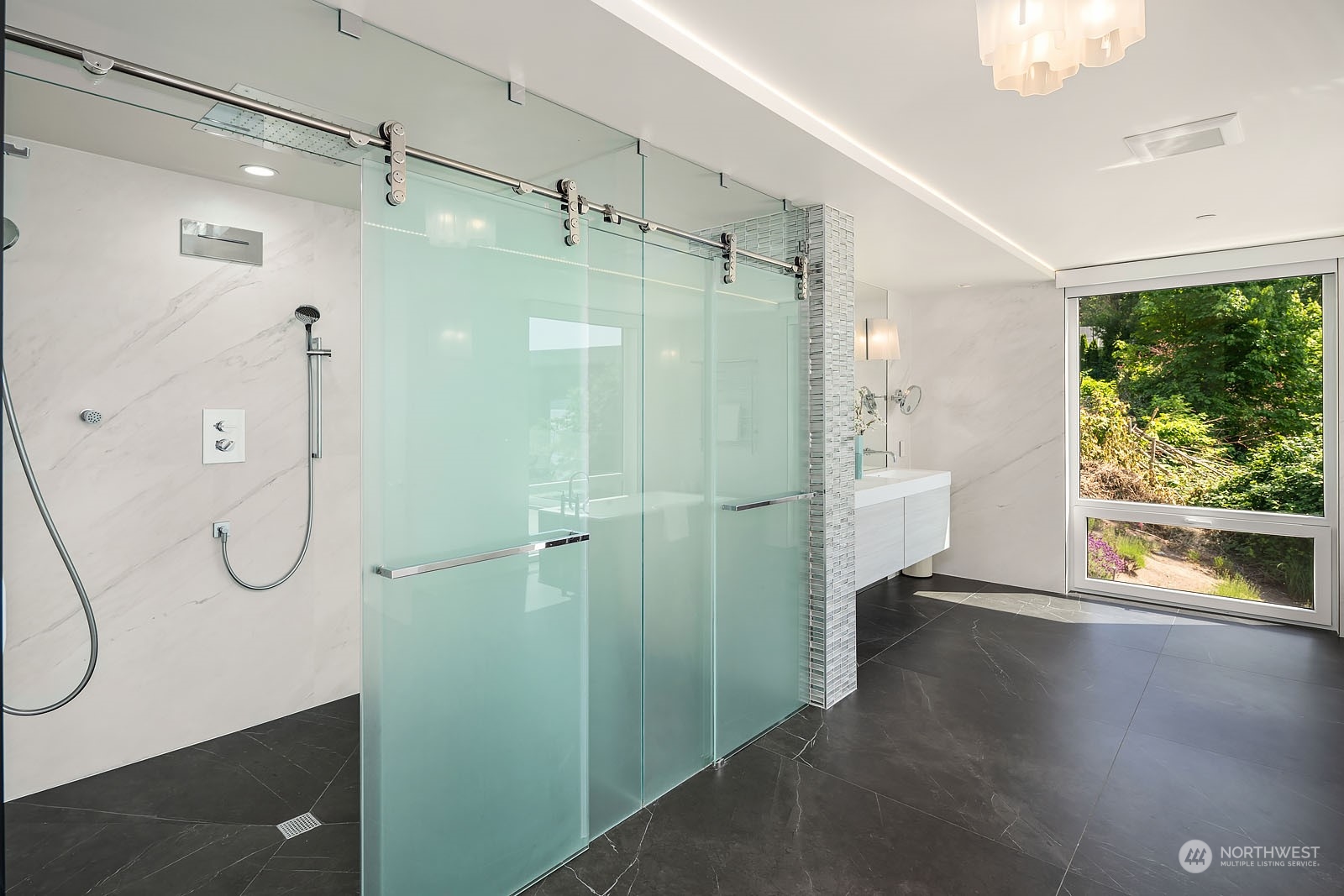 3225 Evergreen Point Road Medina, WA 98039 - Photo 20 of 34 a bathroom with a shower and a sink