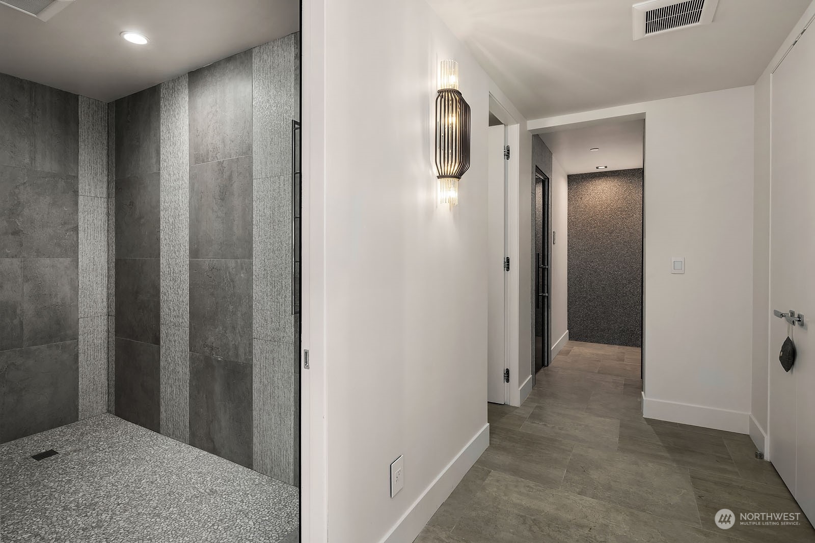 3225 Evergreen Point Road Medina, WA 98039 - Photo 27 of 34 a view of a hallway with closet and wooden floor