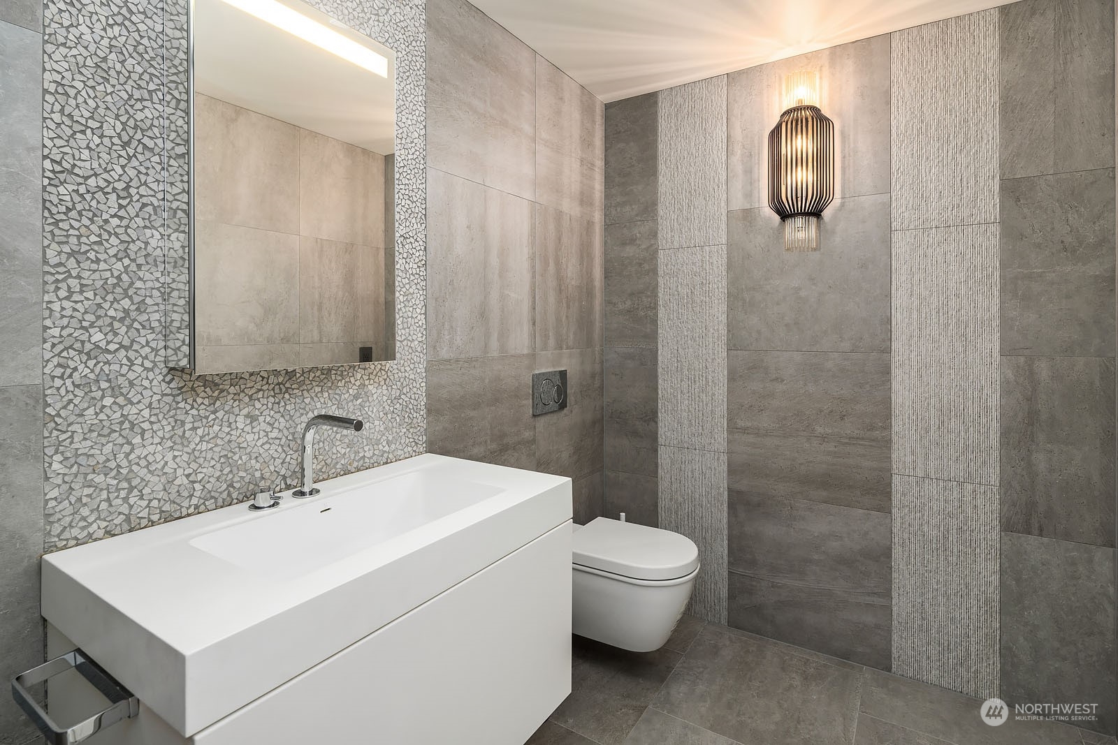 3225 Evergreen Point Road Medina, WA 98039 - Photo 29 of 34 a bathroom with a white sink a toilet and shower