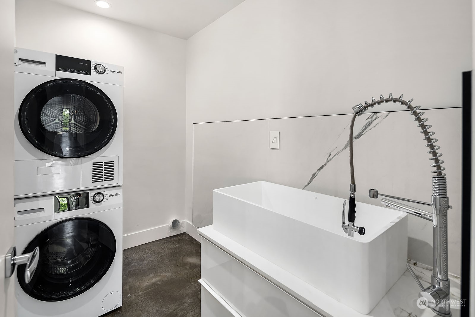 3225 Evergreen Point Road Medina, WA 98039 - Photo 32 of 34 a bathroom with a sink a washer and dryer