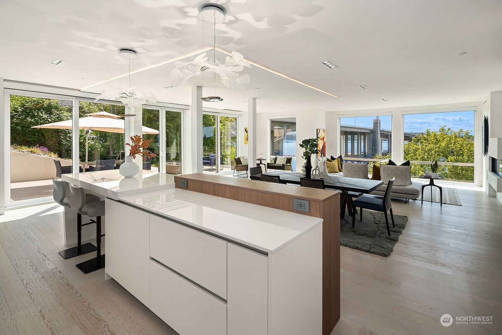 3225 Evergreen Point Road Medina, WA 98039 - Photo 10 of 34 a living room with kitchen island furniture and a large window