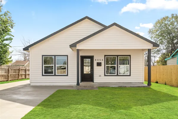 front view of a house with a yard