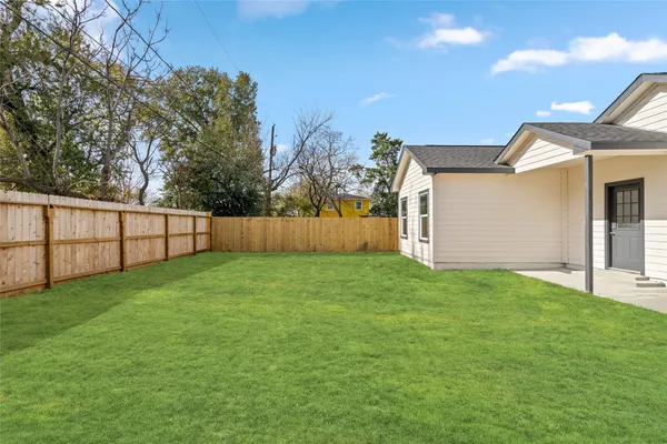 a view of a backyard with a garden and stairs