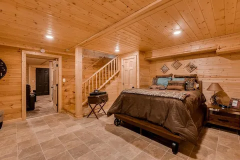 a bedroom with a bed and cabinets