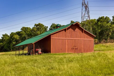 a view of barn with a small yard