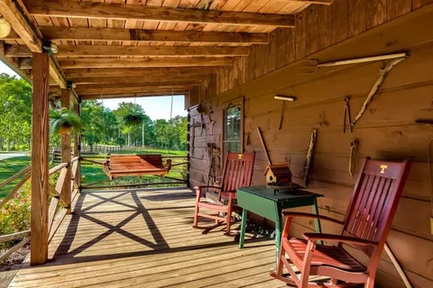 a view of room with wooden floor and outdoor seating