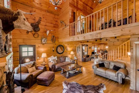 a living room with furniture and a clock