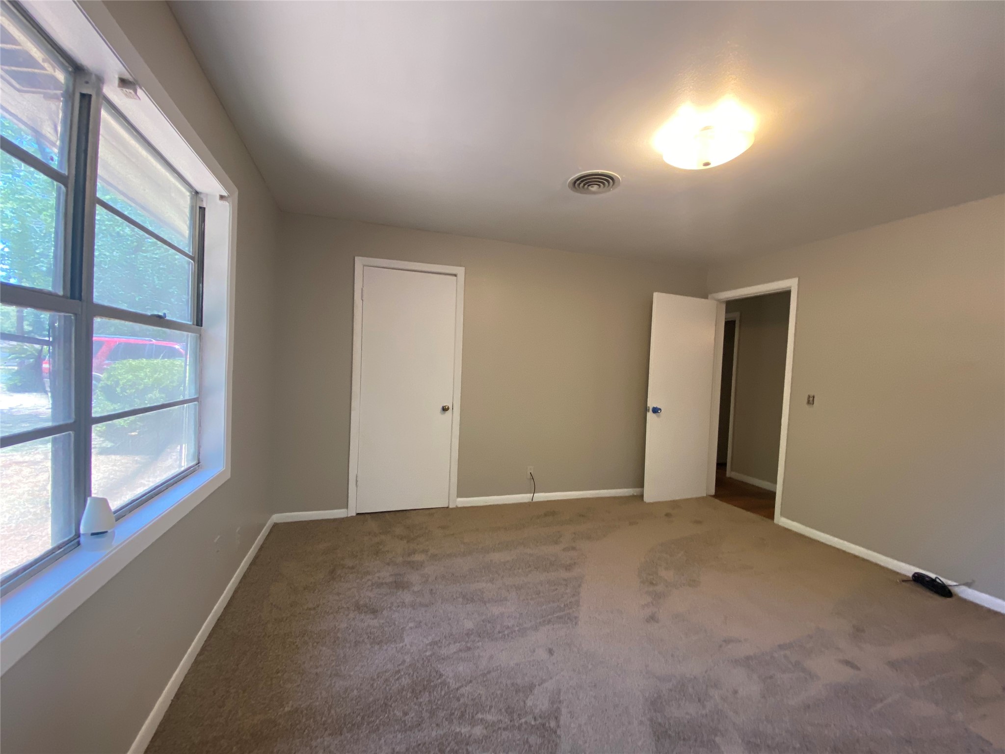 802 Mable Street El Campo, TX 77437 - Photo 13 of 15 a view of an empty room with a window