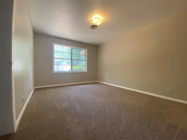 an empty room with windows and windows