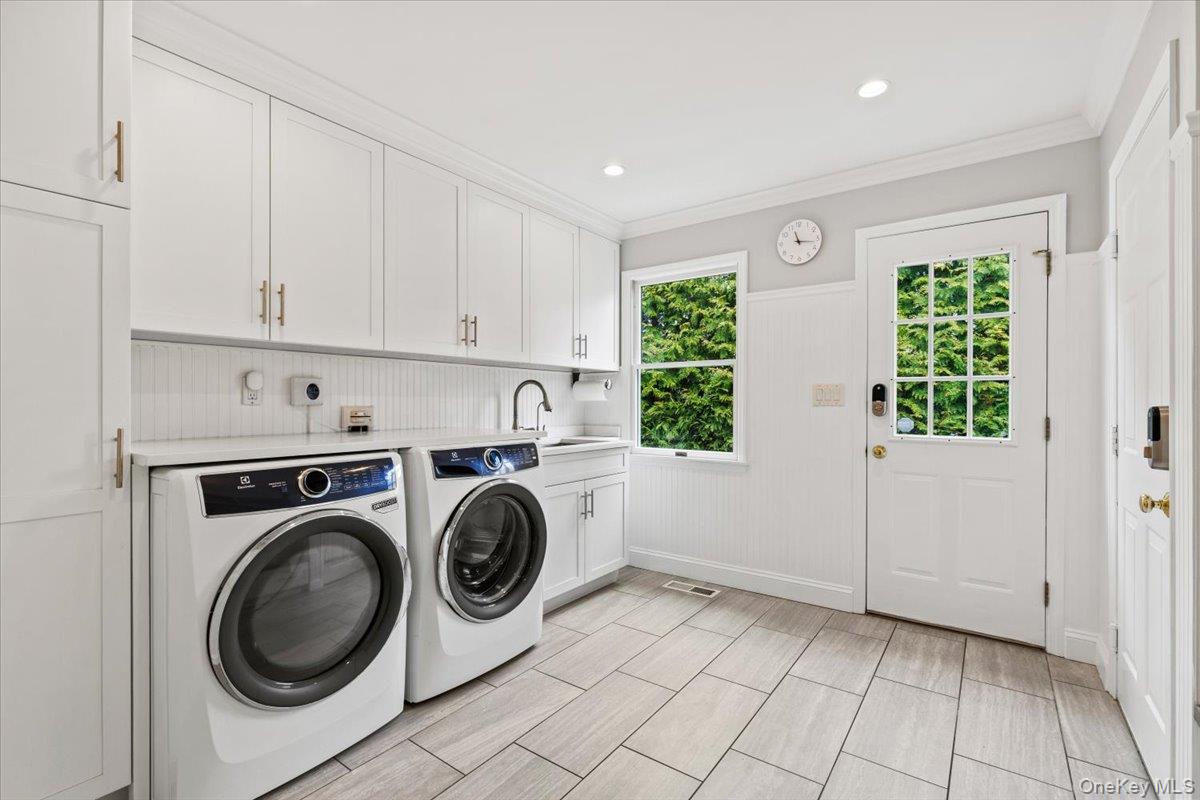 76 Davis Avenue Rye, NY 10580 - Photo 17 of 39 Mudroom/ Laundry room- ample space offering tons of storage with direct access to rear yard and garage