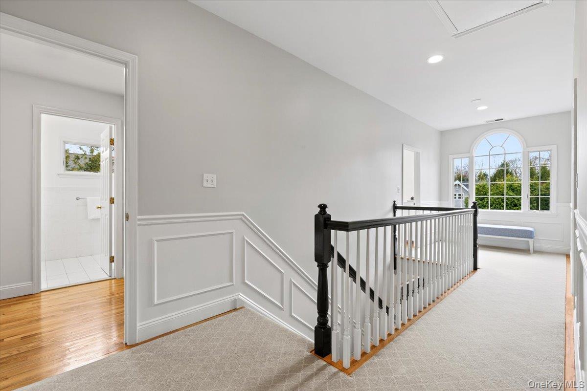 76 Davis Avenue Rye, NY 10580 - Photo 19 of 39 Second floor landing is gracious with tons of light and ceiling height. Custom millwork continues.