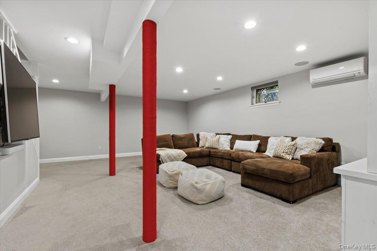 76 Davis Avenue Rye, NY 10580 - Photo 28 of 39 Finished basement- large open space with custom built-ins/ bookshelves