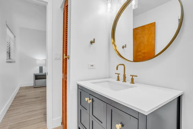 a bedroom with a bed and a night stand