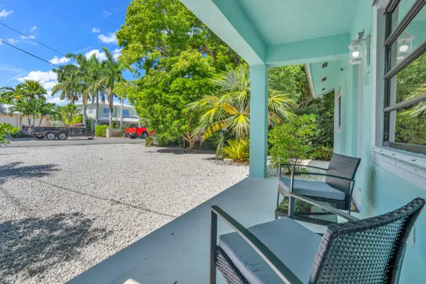 an aerial view of a houses with a yard