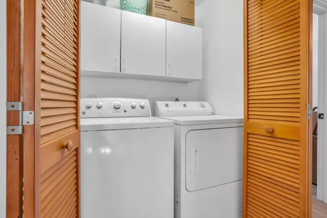 a kitchen with a stove a refrigerator and a stove top oven