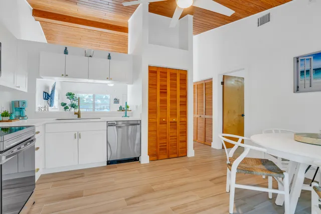 a room with pool table and chairs