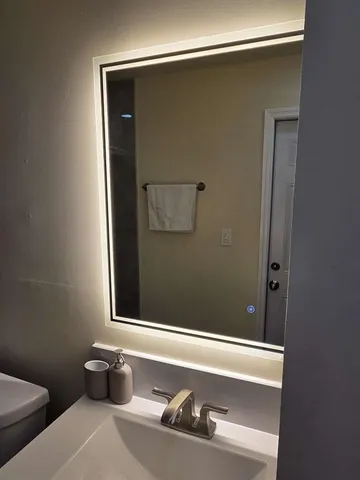 a bathroom with a tub and toilet