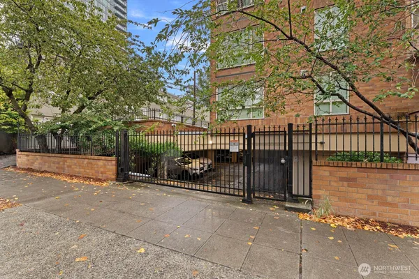 a view of a house with a iron fence