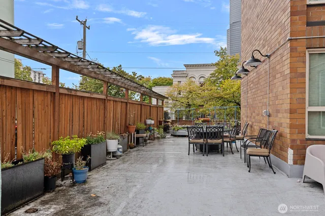 a view of a chairs and table in the patio