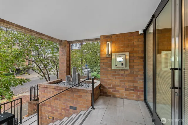 a balcony with furniture and a potted plant