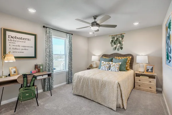 a bedroom with bed and window