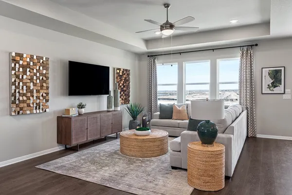 a kitchen with kitchen island granite countertop a dining table chairs cabinets and stainless steel appliances