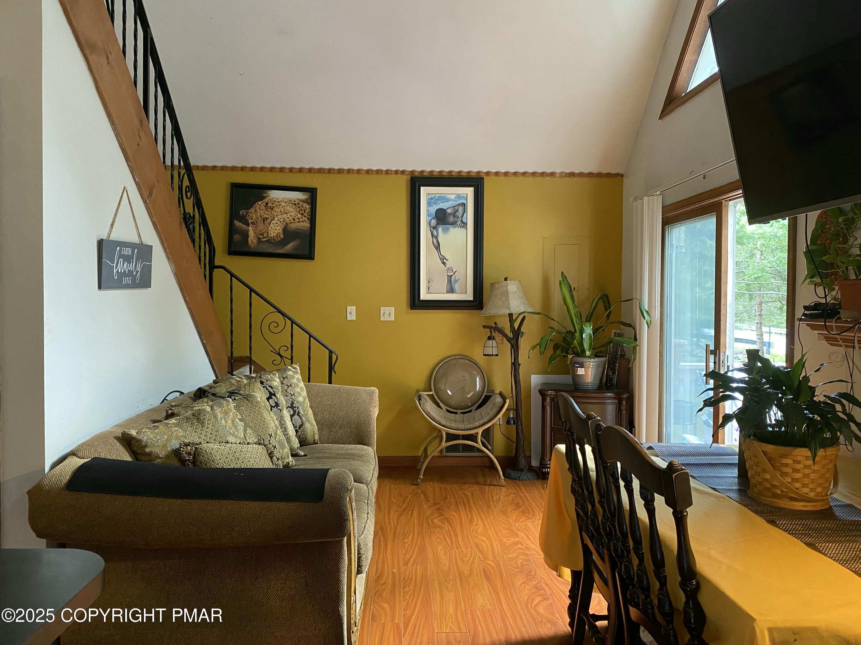 6119 Decker Road Bushkill, PA 18324 - Photo 4 of 8 a living room with furniture rug and wooden floor