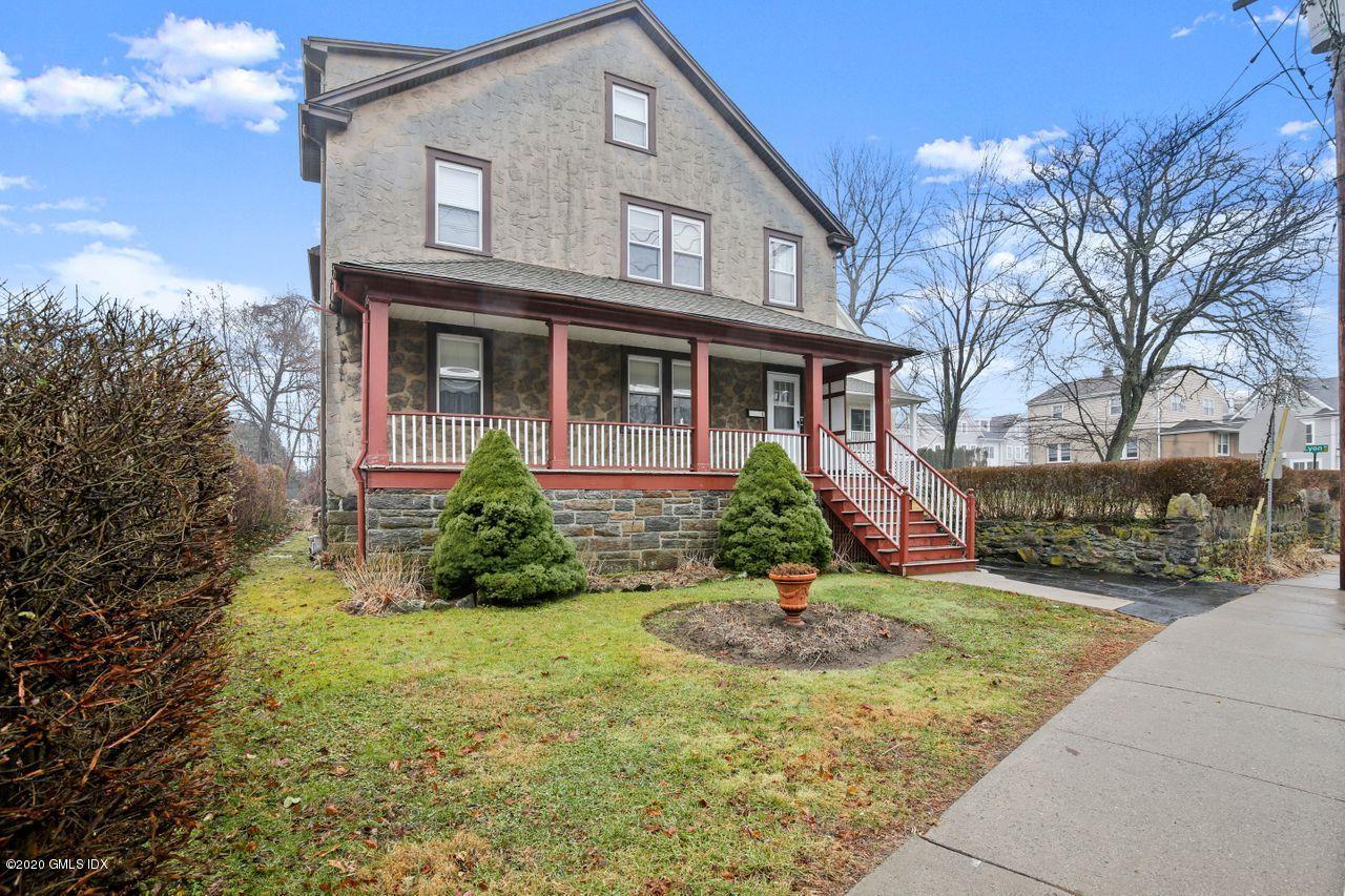 28 St Roch Avenue Greenwich, CT 06830 - Photo 1 of 15 a front view of a house with a yard