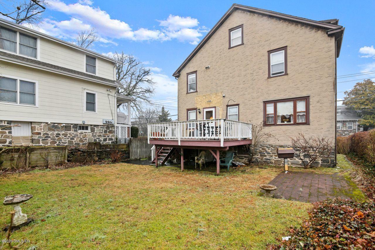 28 St Roch Avenue Greenwich, CT 06830 - Photo 11 of 15 a view of a house with backyard and sitting area