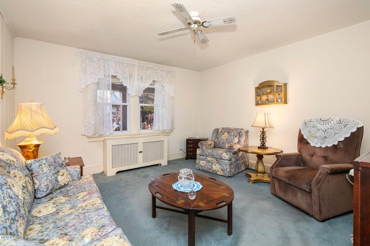 28 St Roch Avenue Greenwich, CT 06830 - Photo 6 of 15 a living room with furniture and a wooden floor