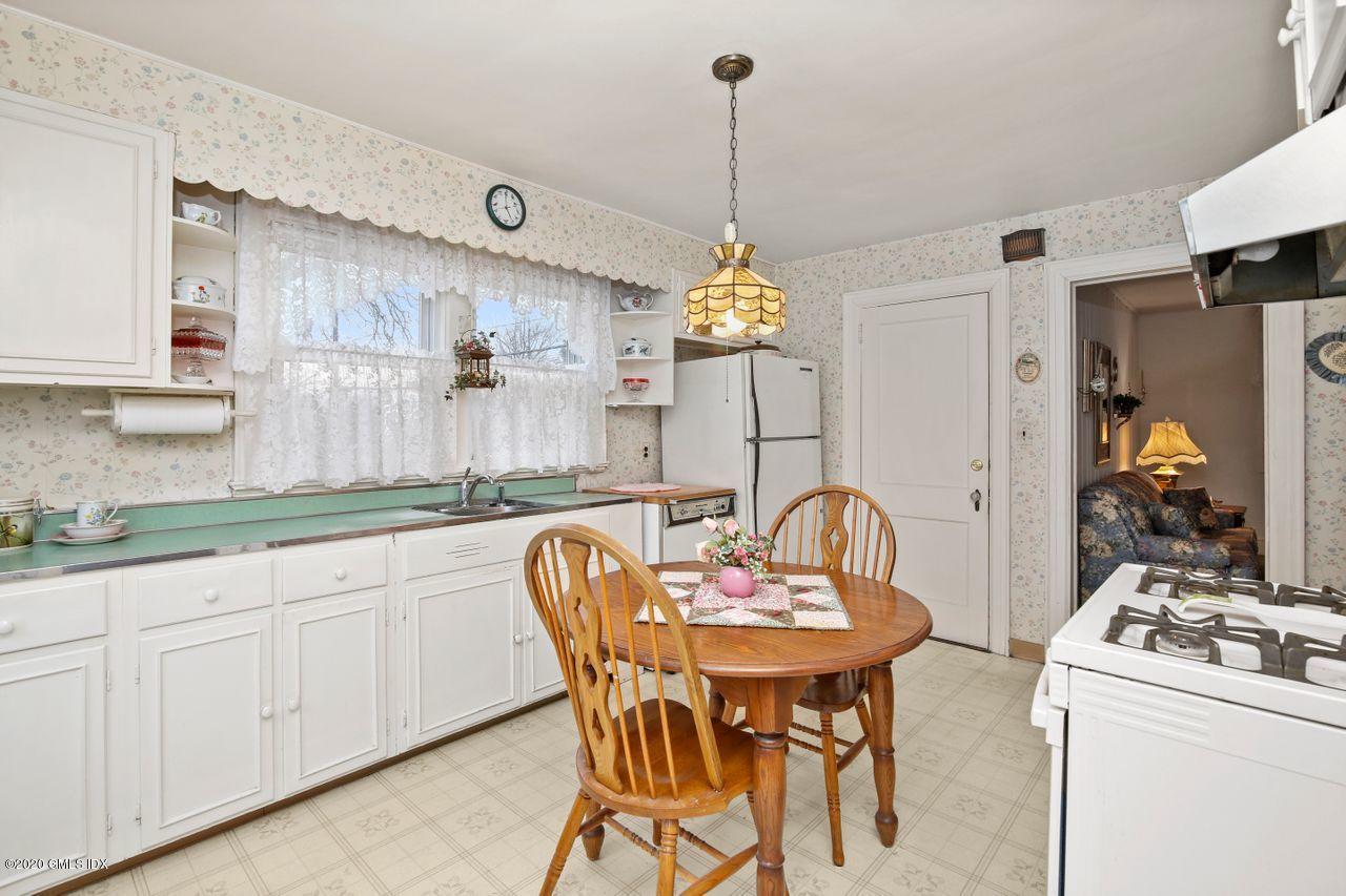 28 St Roch Avenue Greenwich, CT 06830 - Photo 9 of 15 a dining room with furniture and window