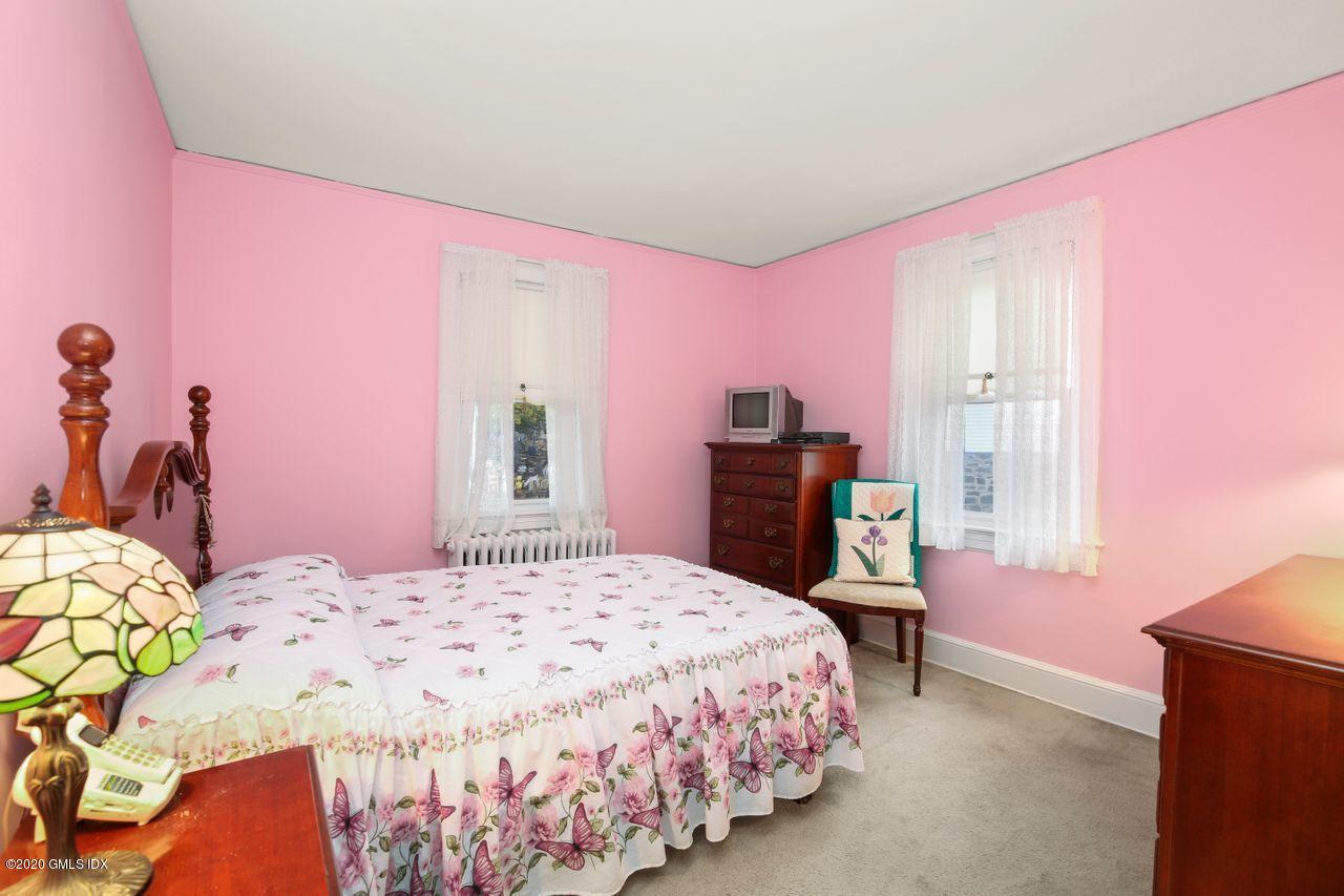 28 St Roch Avenue Greenwich, CT 06830 - Photo 10 of 15 a bedroom with a bed and a closet