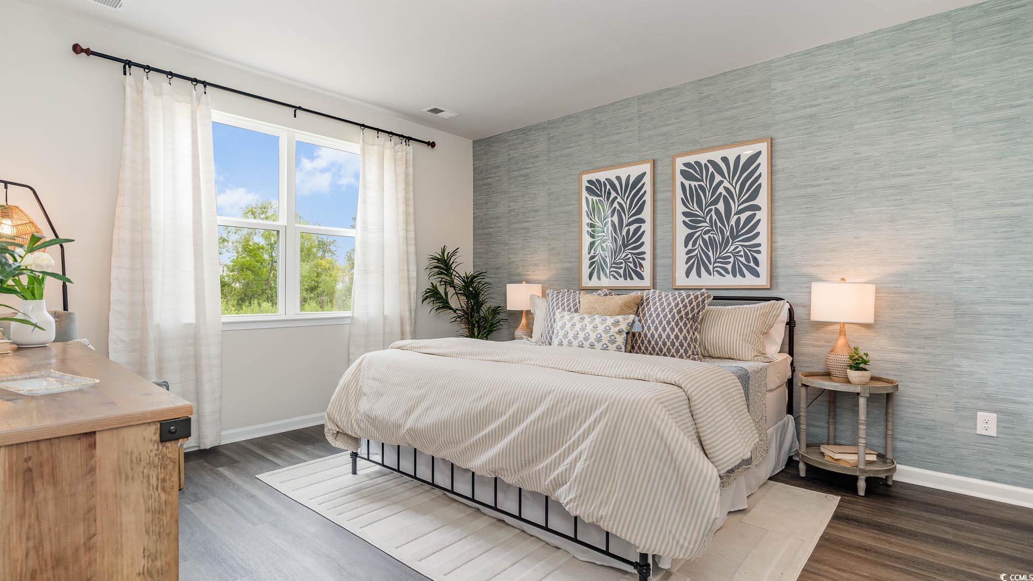 113 Homestead Way Myrtle Beach, SC 29588 - Photo 12 of 20 Bedroom with an accent wall, wallpapered walls, and dark wood-style floors