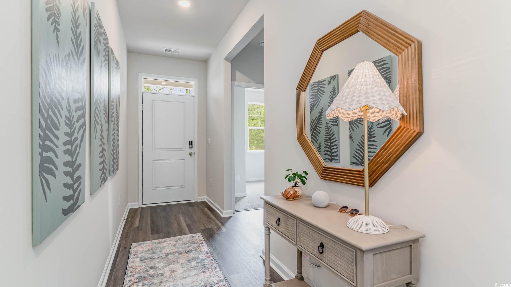 113 Homestead Way Myrtle Beach, SC 29588 - Photo 3 of 20 Doorway with baseboards and wood finished floors