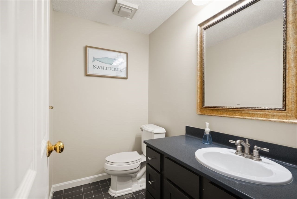 8 Bellingham Court, Unit 92 Middleton, MA 01949 - Photo 17 of 35 a bathroom with a sink toilet and mirror