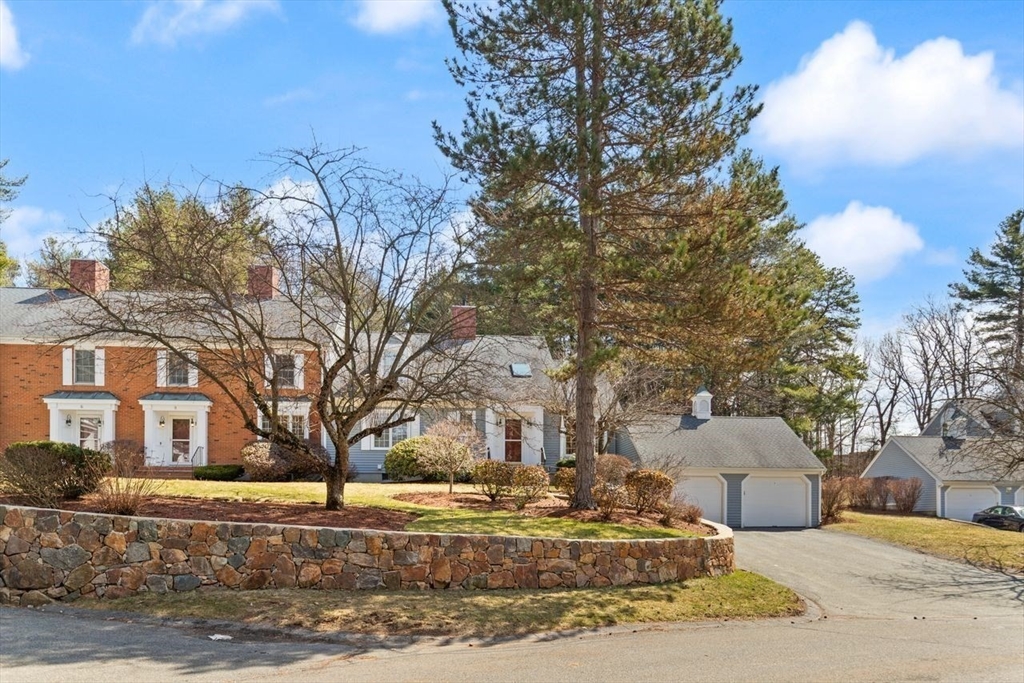 8 Bellingham Court, Unit 92 Middleton, MA 01949 - Photo 2 of 35 a front view of a house with a yard