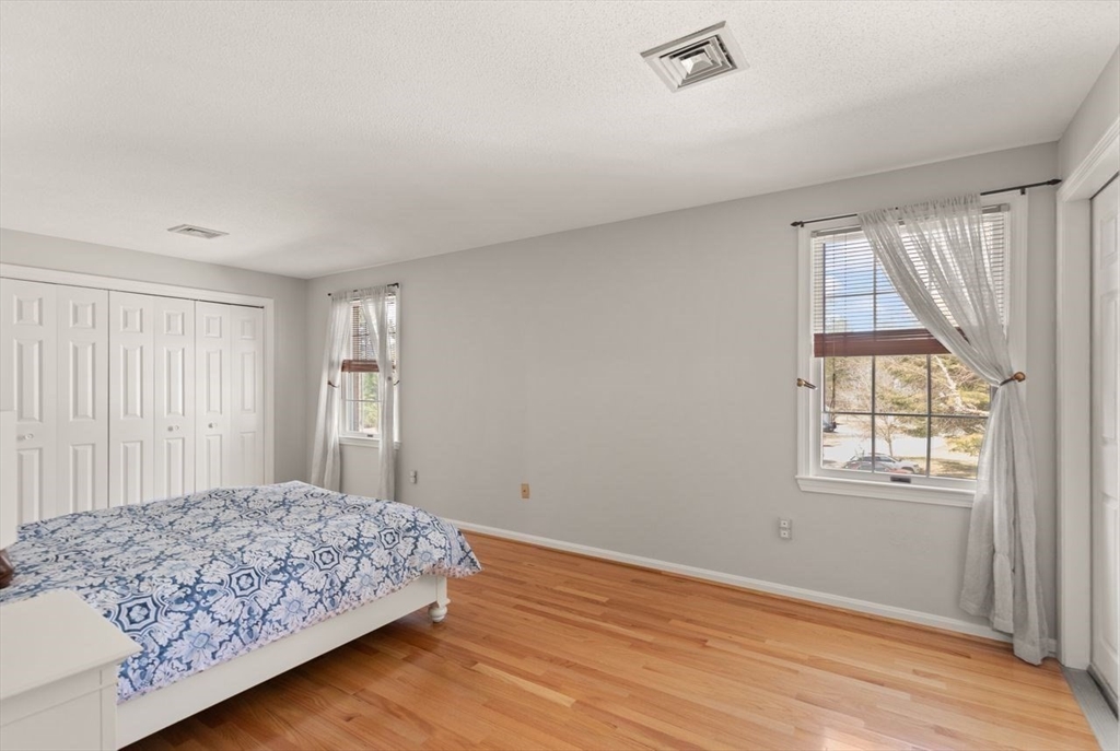 8 Bellingham Court, Unit 92 Middleton, MA 01949 - Photo 22 of 35 a bedroom with a bed and a window