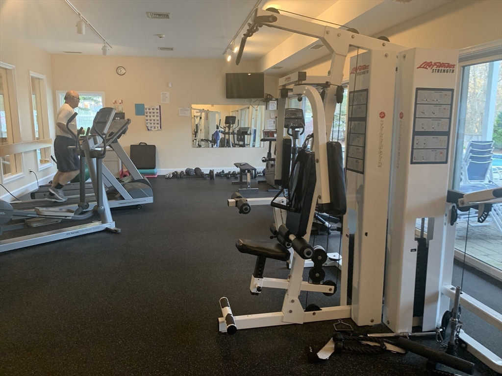 8 Bellingham Court, Unit 92 Middleton, MA 01949 - Photo 30 of 35 a view of a room with gym equipment