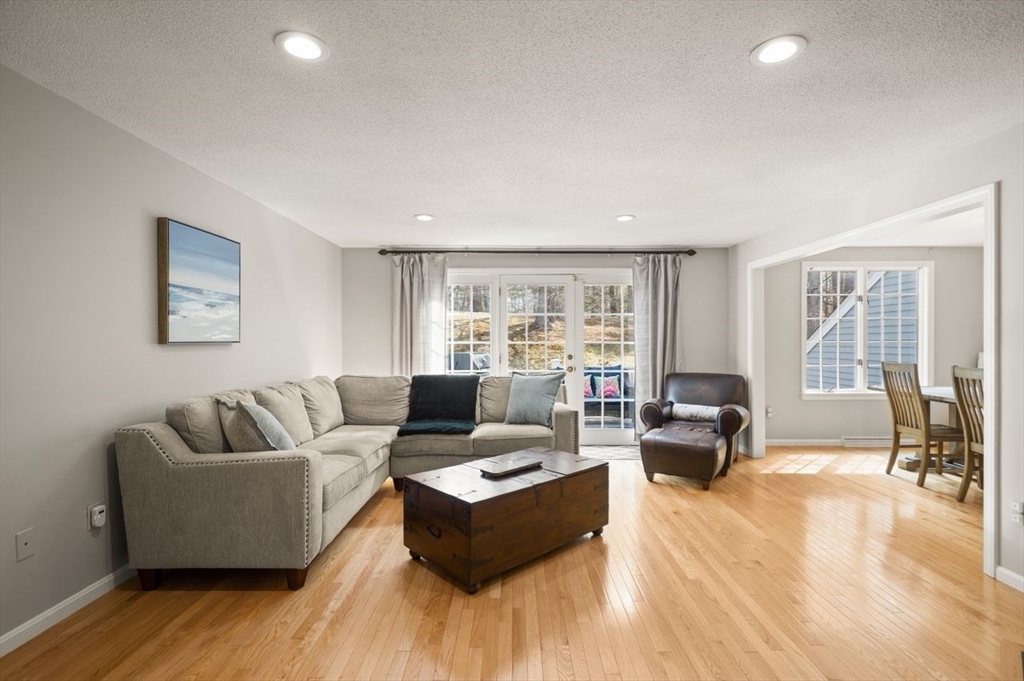 8 Bellingham Court, Unit 92 Middleton, MA 01949 - Photo 6 of 35 a living room with furniture and a couch