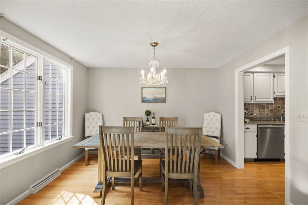 8 Bellingham Court, Unit 92 Middleton, MA 01949 - Photo 8 of 35 a view of a dining room with furniture window and outside view