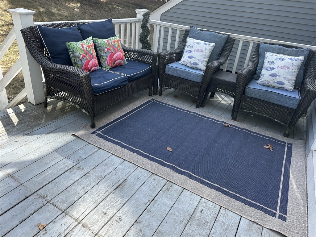 8 Bellingham Court, Unit 92 Middleton, MA 01949 - Photo 10 of 35 a outdoor living space with furniture and a rug