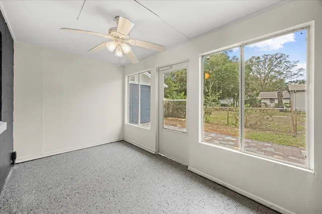 a view of house with backyard and window