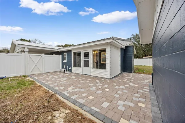a view of utility room with racks and windows