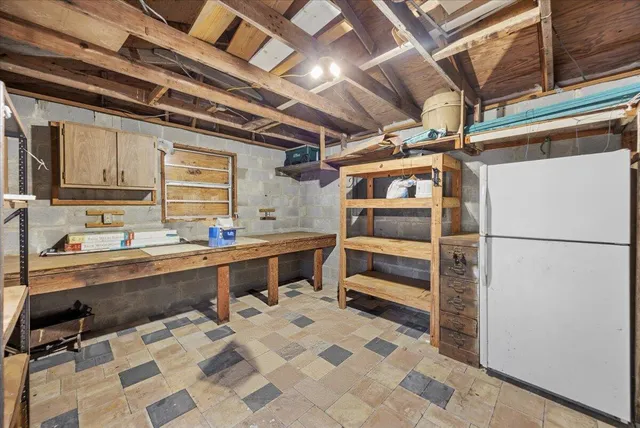 a view of a kitchen with stainless steel appliances granite countertop a sink and cabinets