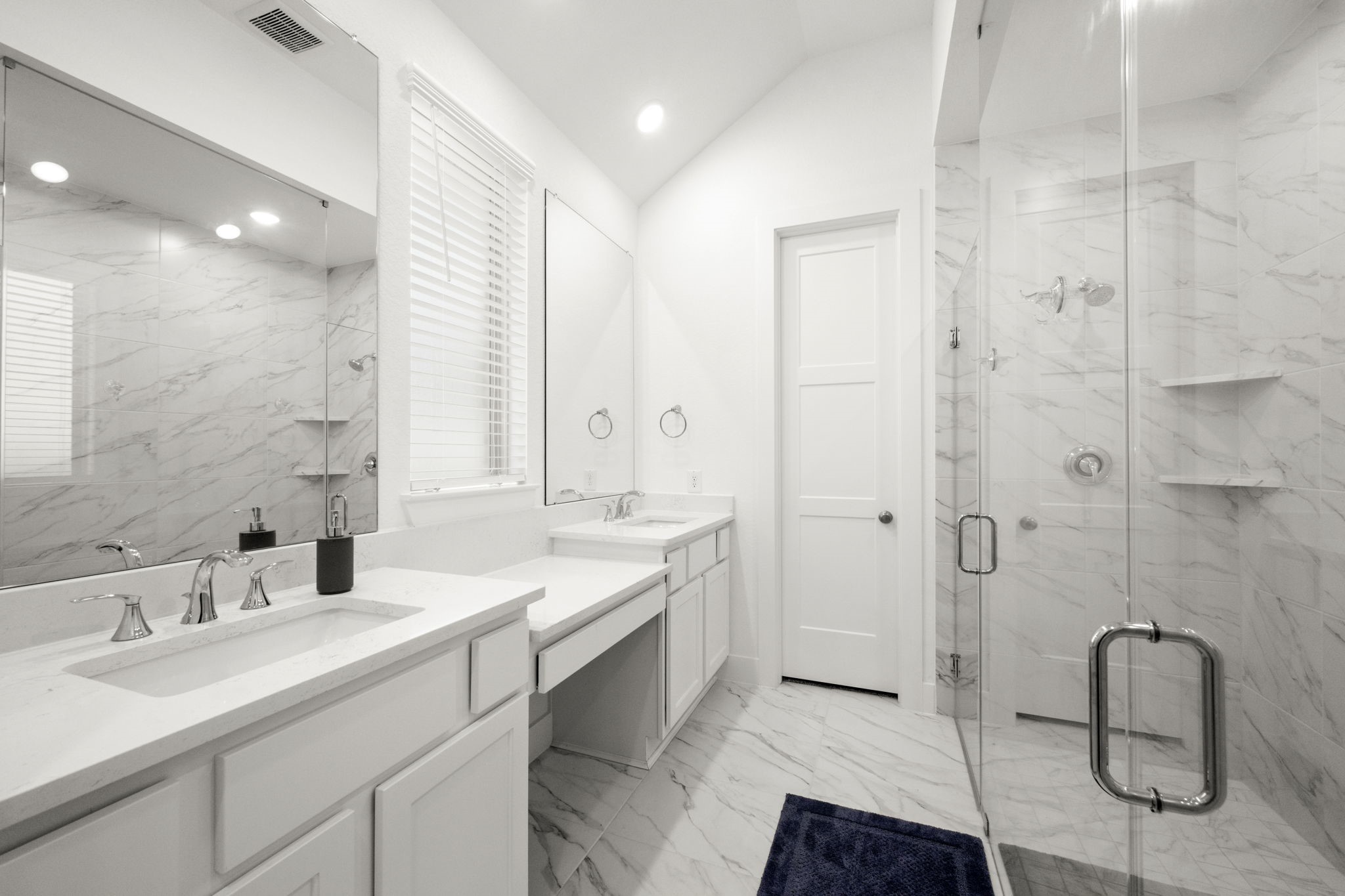13035 Wandering Rdg Lane Conroe, TX 77302 - Photo 18 of 28 a bathroom with a double vanity sink mirror and bathtub