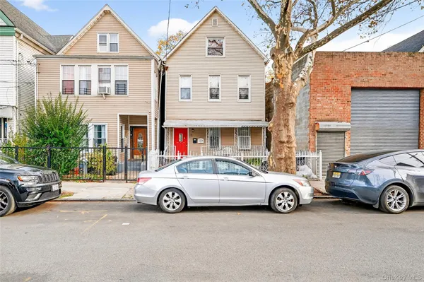 a car parked in front of a house