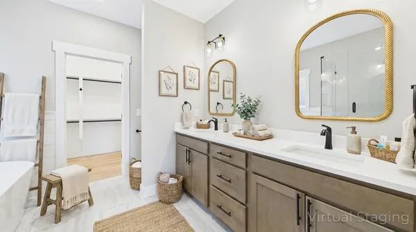 a bathroom with a double vanity sink mirror and