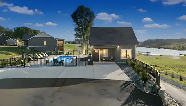 a living room with furniture and kitchen view