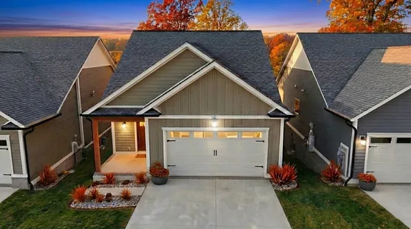 a view of a patio with dining table and chairs with a yard